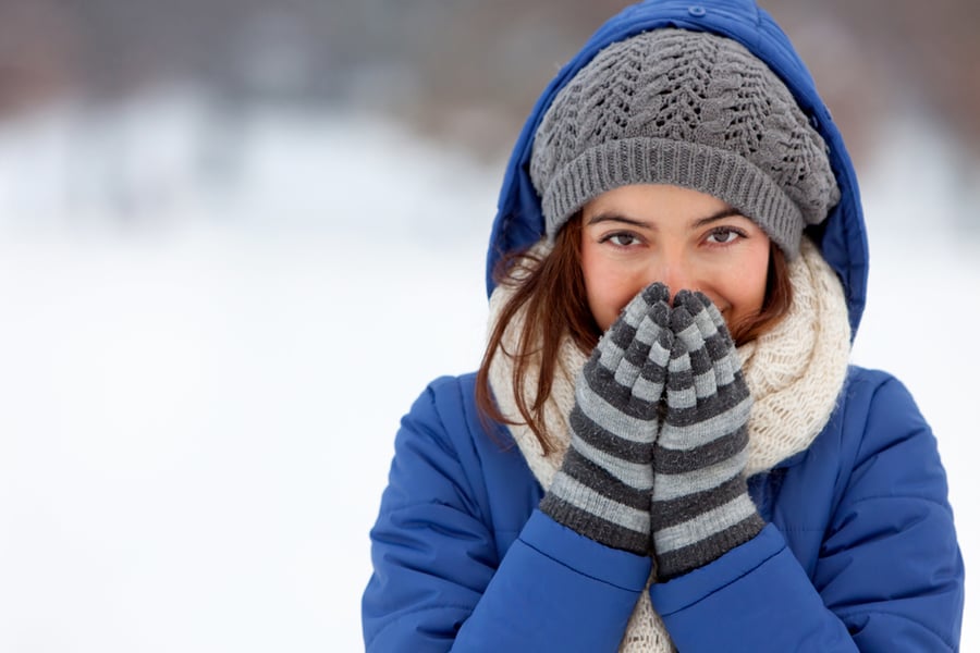 Portrait of a woman feeling cold in winter 